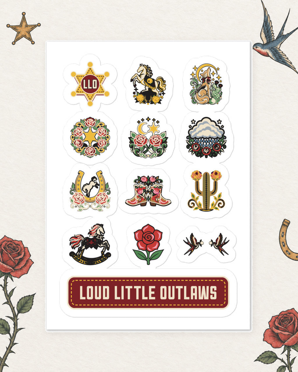 Little Outlaw Flash Sticker Sheet in Multicolor, product view on pale ivory with faded colored tattoo flash.