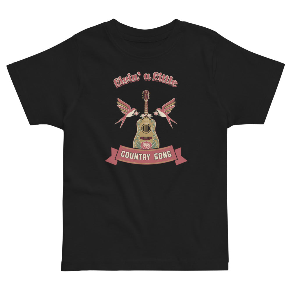 Livin' a Little Country Song Toddler T-Shirt, black, floral acoustic guitar, swallows and country-song ribbon, product view.