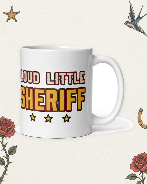 Loud Little Sheriff Mug in White, product view on pale ivory with faded colored tattoo flash.