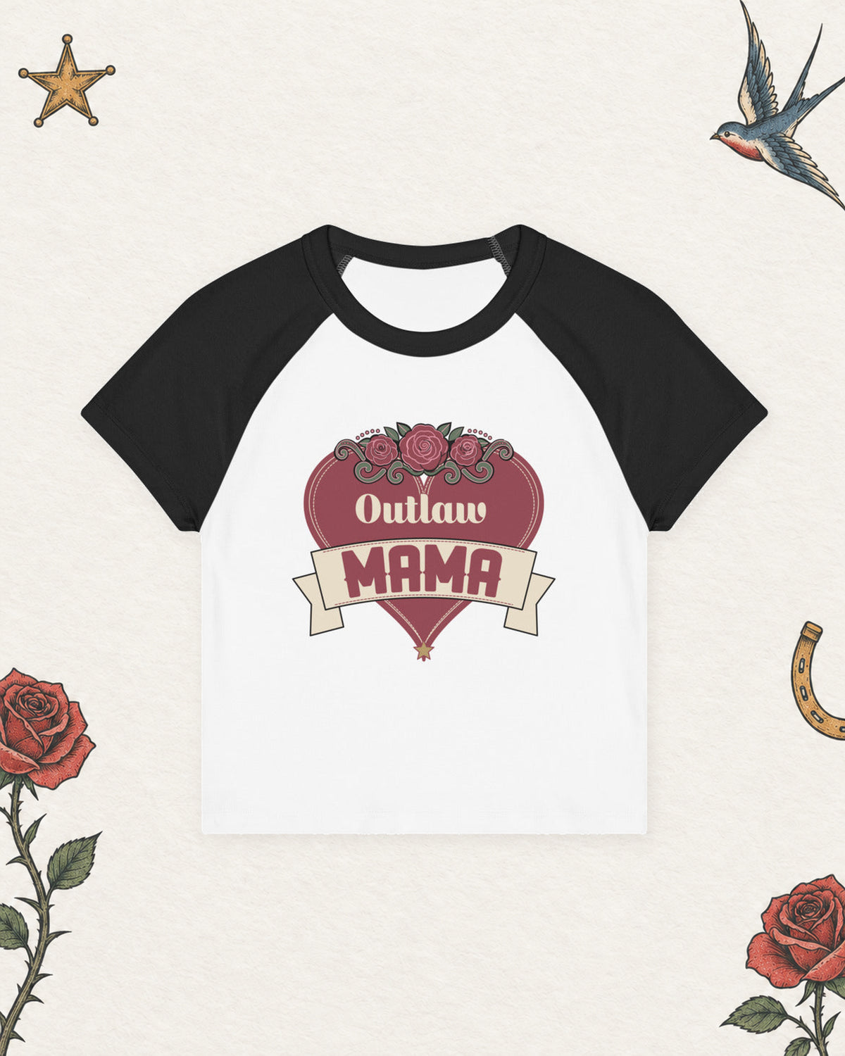 Outlaw Mama Women's Raglan Baby Tee in White / Black, product view on pale ivory with faded colored tattoo flash.