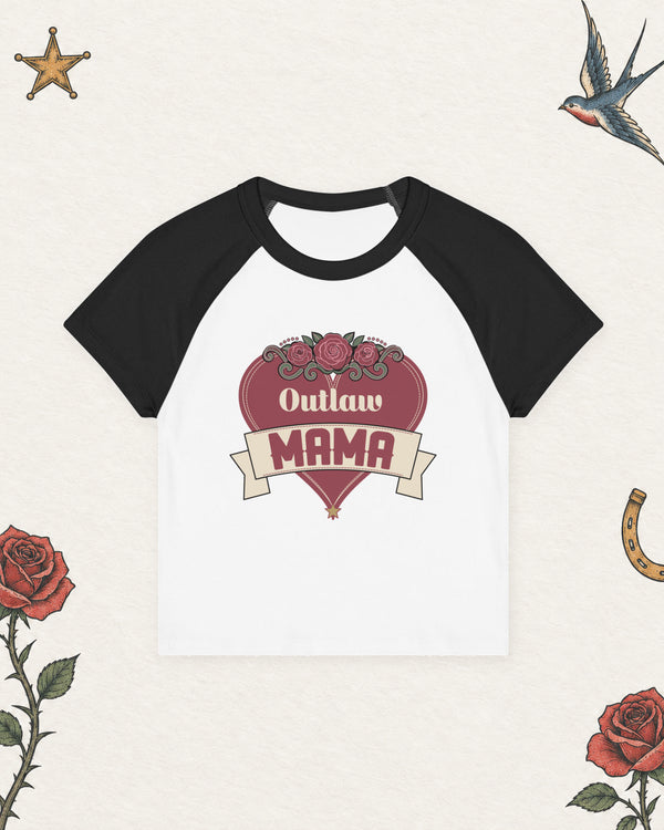 Outlaw Mama Women's Raglan Baby Tee in White / Black, product view on pale ivory with faded colored tattoo flash.