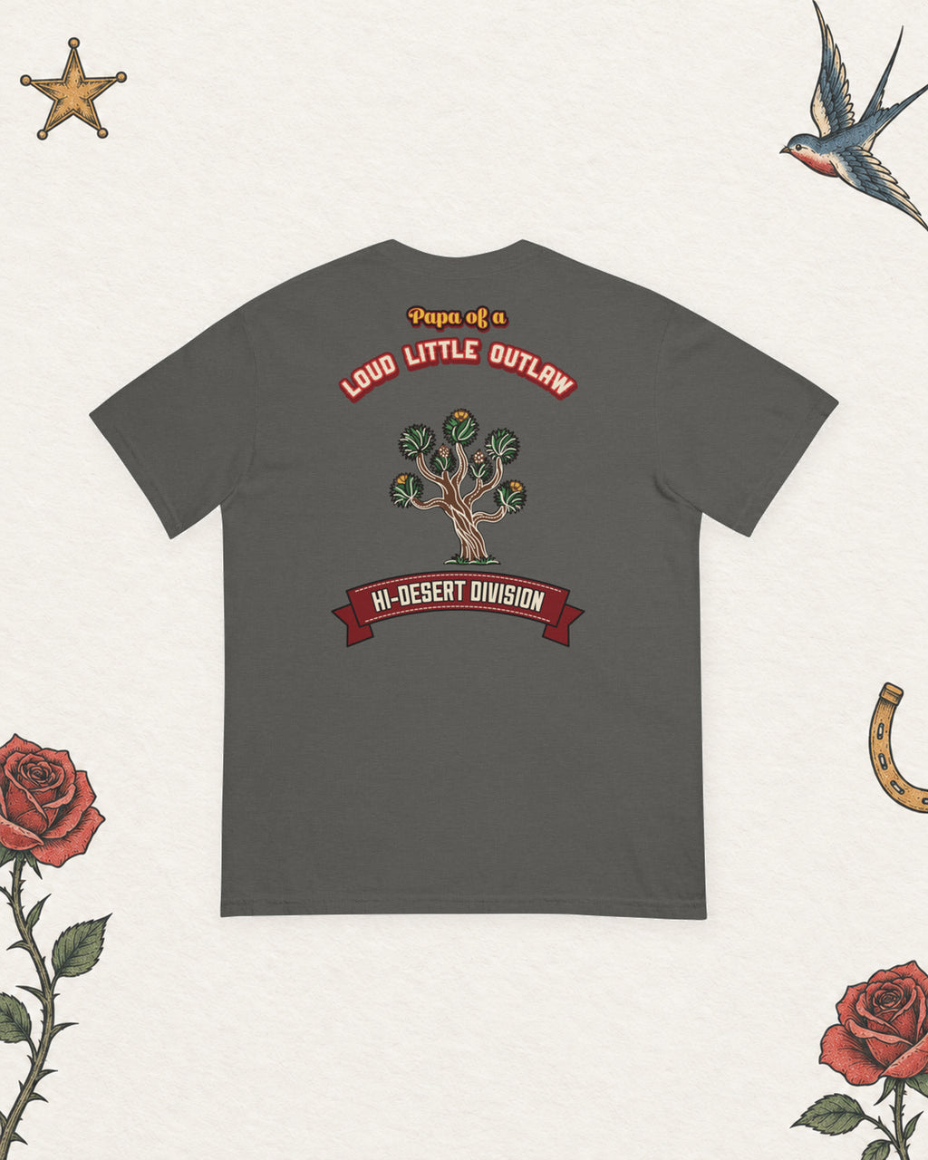 Papa of a Loud Little Outlaw Hi-Desert Heavyweight Tee in Pepper, back view on pale ivory with faded colored tattoo flash.