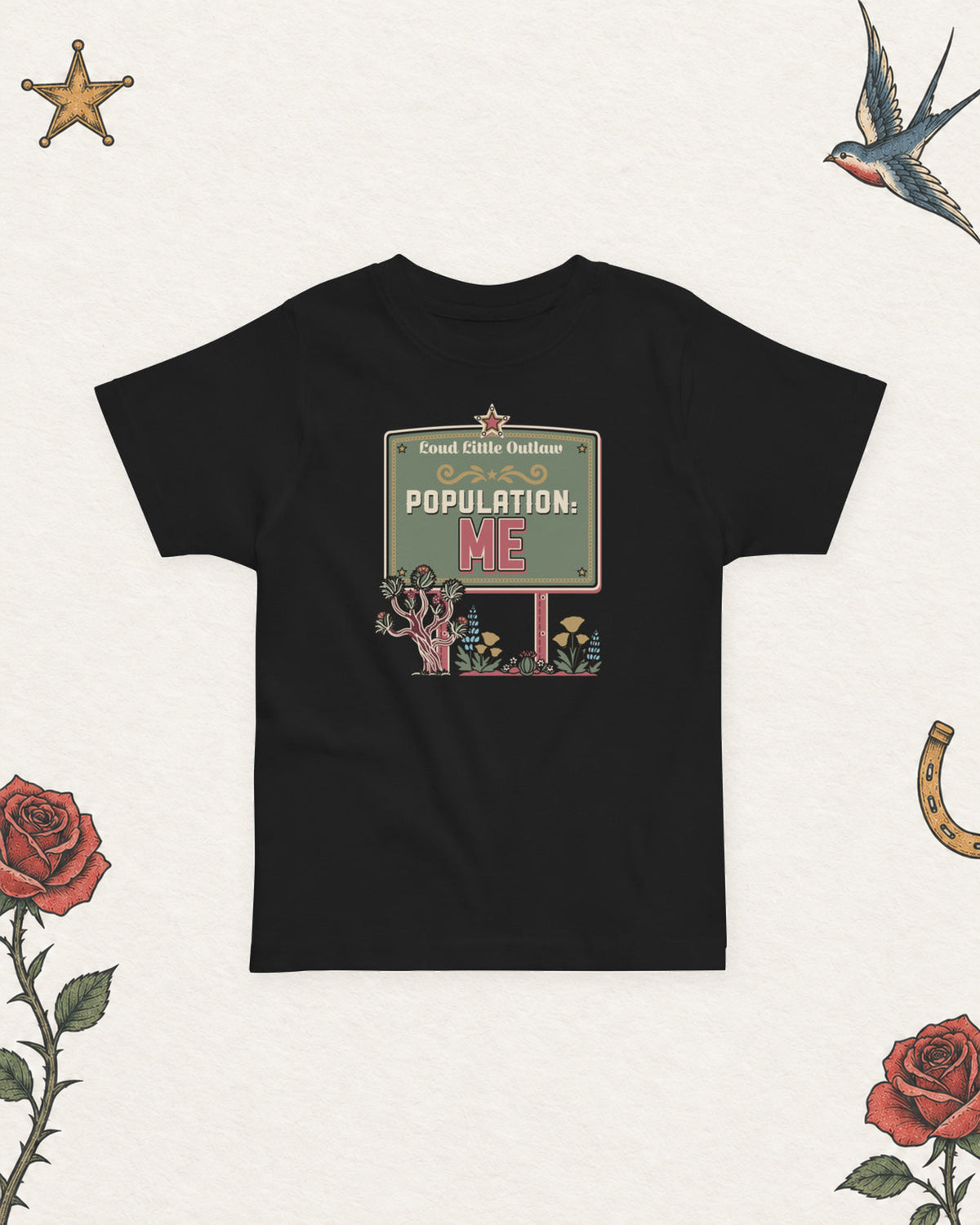 Population: Me Desert Western Toddler T-Shirt in Black, product view on pale ivory with faded colored tattoo flash.