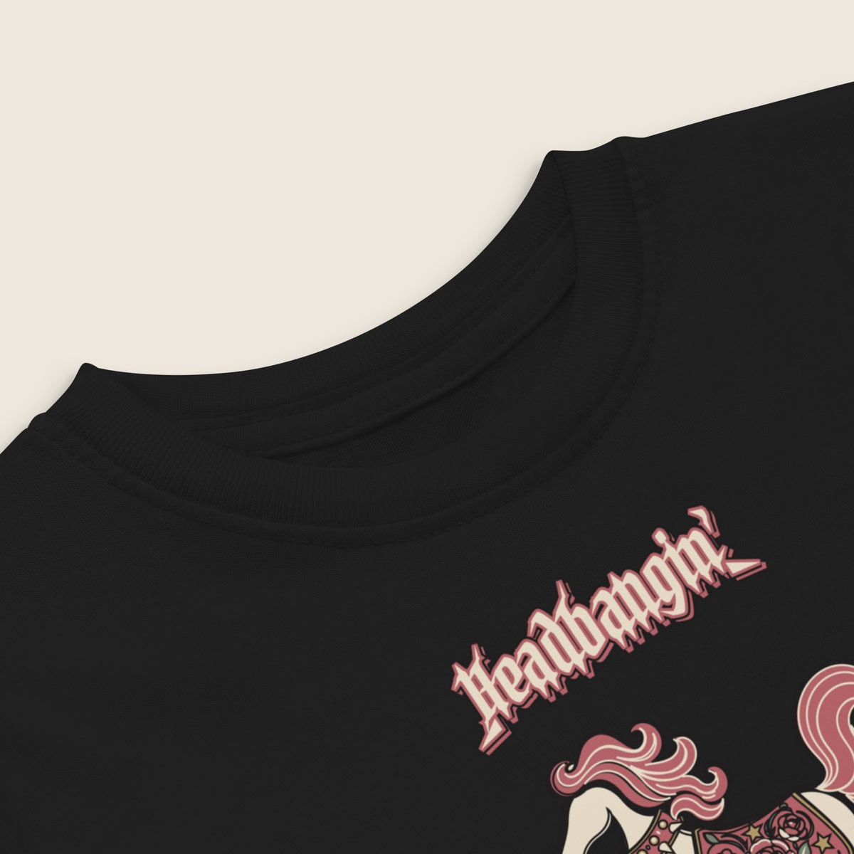 Headbangin' Buckaroo Toddler Tee in Black, close-up of the print