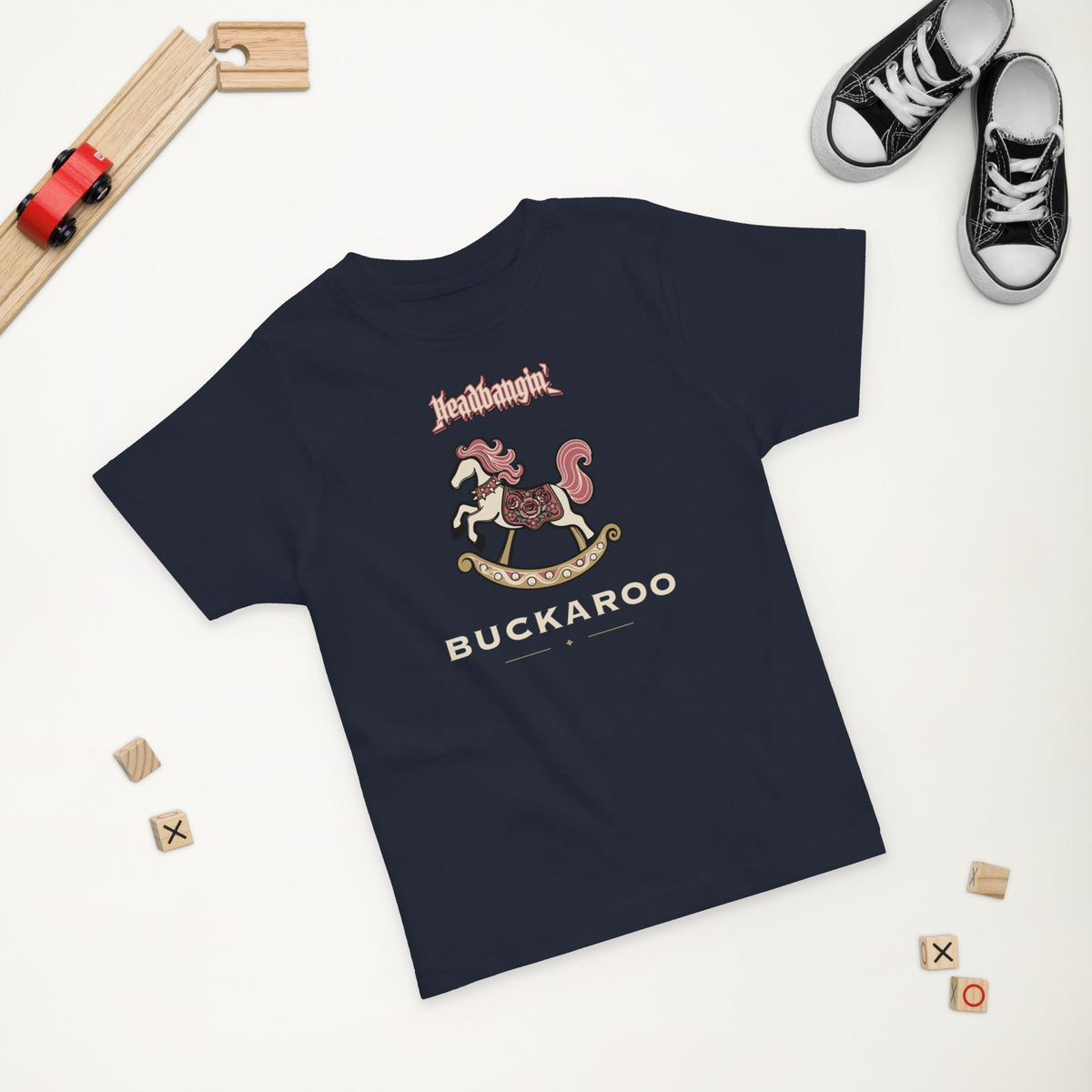 Headbangin' Buckaroo Toddler Tee in Navy, styled flat lay, second angle