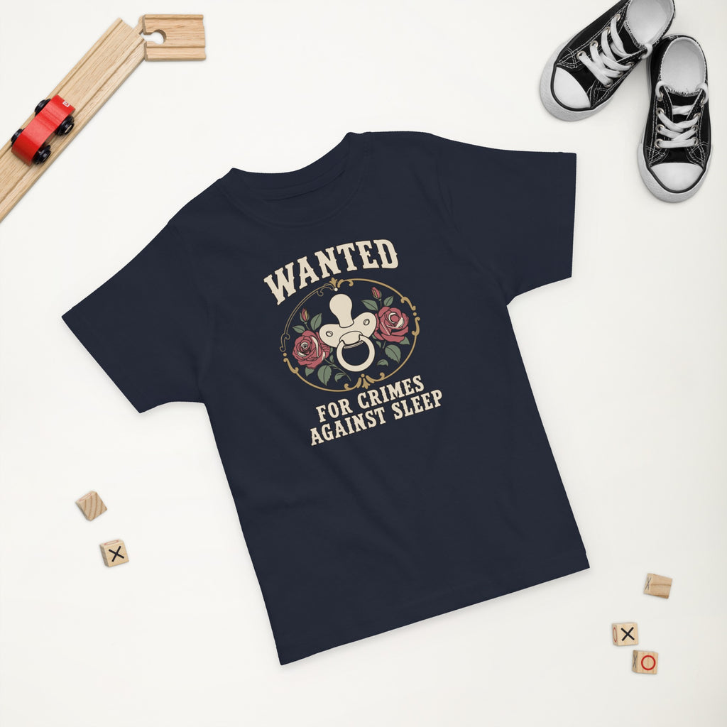 Wanted: For Crimes Against Sleep Toddler Tee in Navy, styled flat lay, second angle