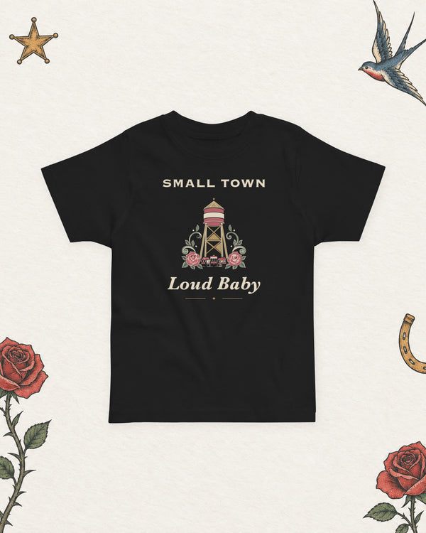 Small Town, Loud Baby Toddler Tee in Black, product view on pale ivory with faded colored tattoo flash.