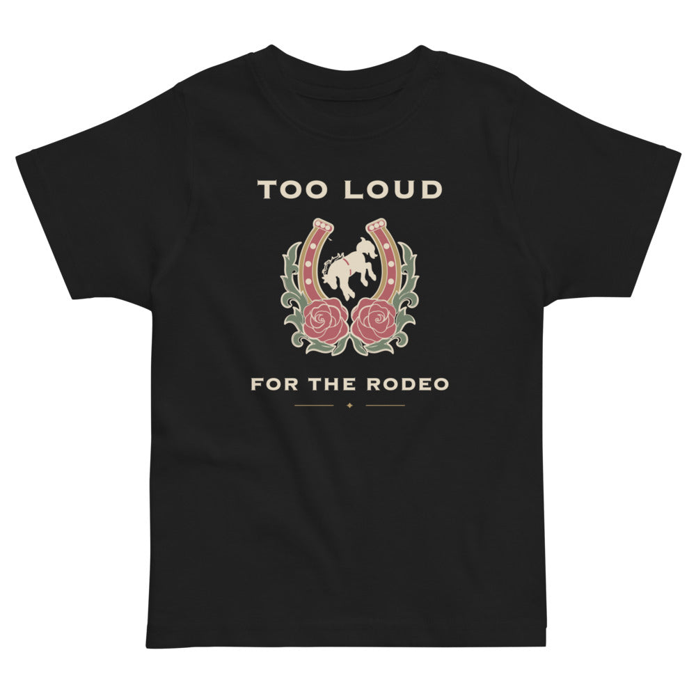 Too Loud for the Rodeo Toddler Tee, black, rearing horse inside a rose-trimmed horseshoe, product view.