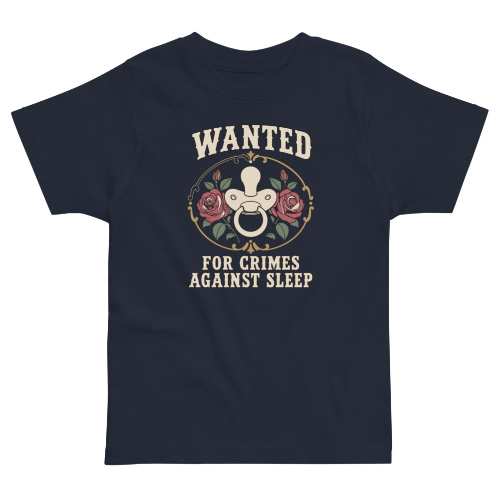 Wanted: For Crimes Against Sleep Toddler Tee, navy, rose-framed pacifier cameo with western Wanted lettering, product view.