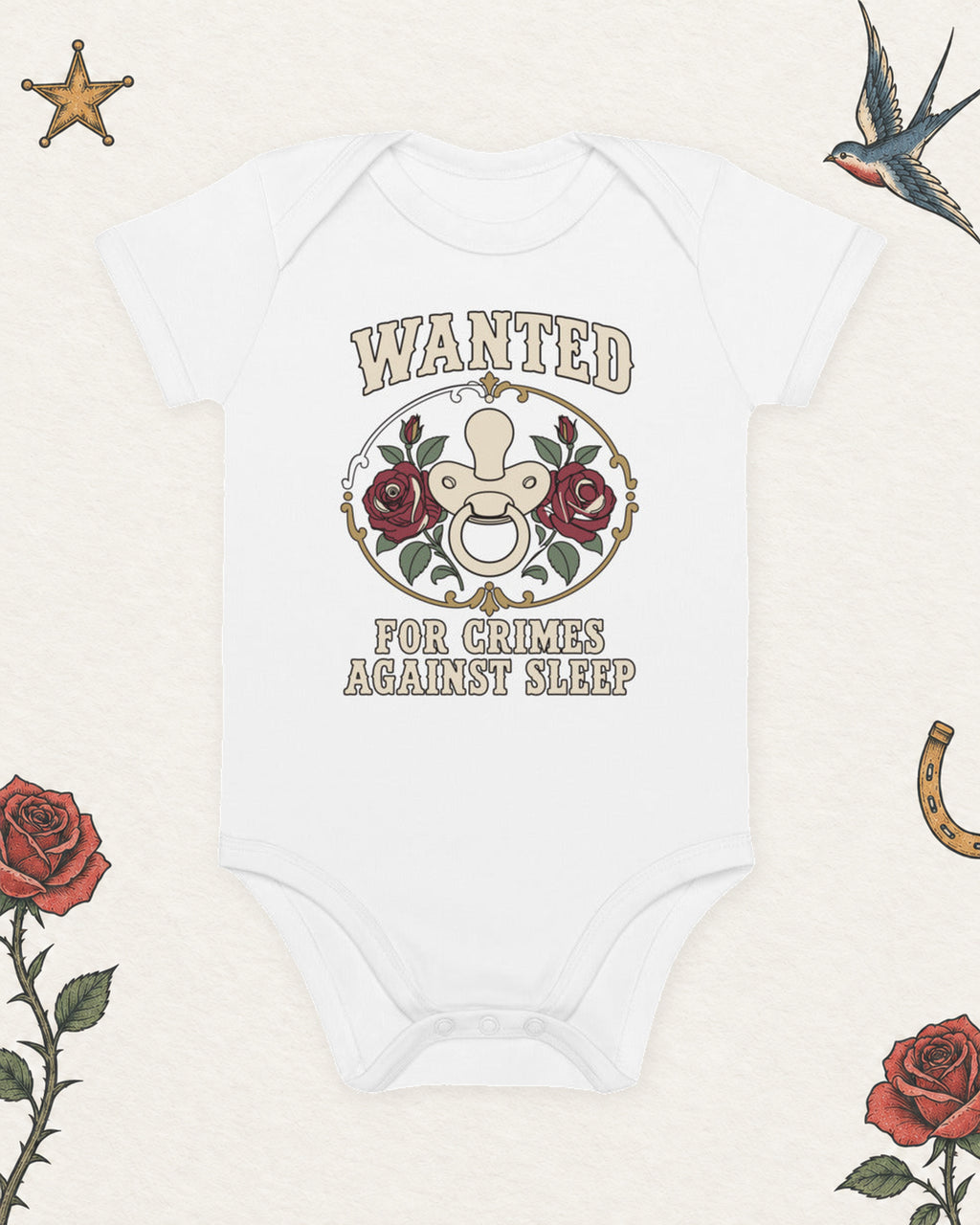 Wanted: For Crimes Against Sleep Organic Baby Bodysuit in White, product view on pale ivory with faded colored tattoo flash.