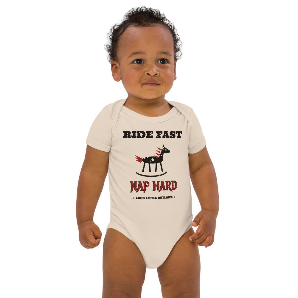 Ride Fast, Nap Hard Organic Baby Bodysuit, Natural, natural, rocking horse with a red flame mane and white stars between Ride Fast and Nap Hard lettering, front view.